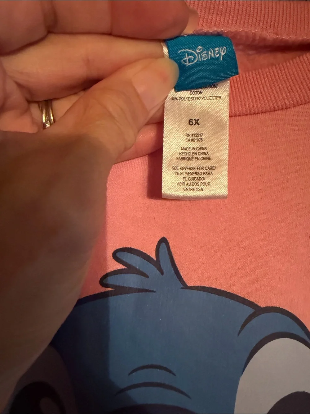 Disney Pink Crewneck Sweatshirt with Blue Stitch Holding Heart